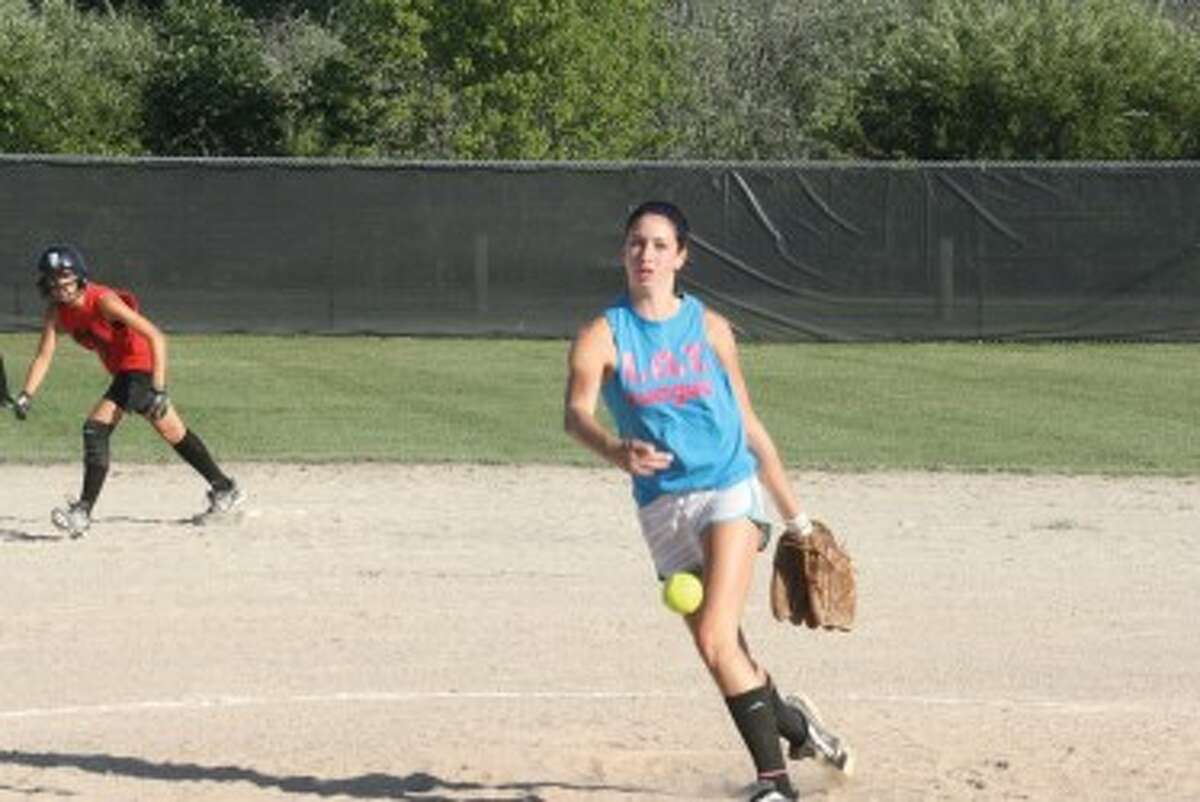 MAKING A PITCH FOR VARSITY: Paige Esiline of Pine River delivers a pitch against Reed City. (Herald Review photo/John Raffel)
