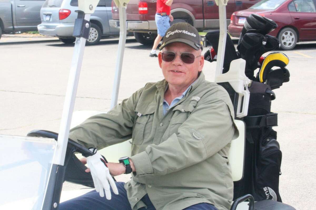 Mens golf: Jim Staton of Bitely gets ready for a round of golf at Marquette Trails Golf Club. (Herald Review/John Raffel)
