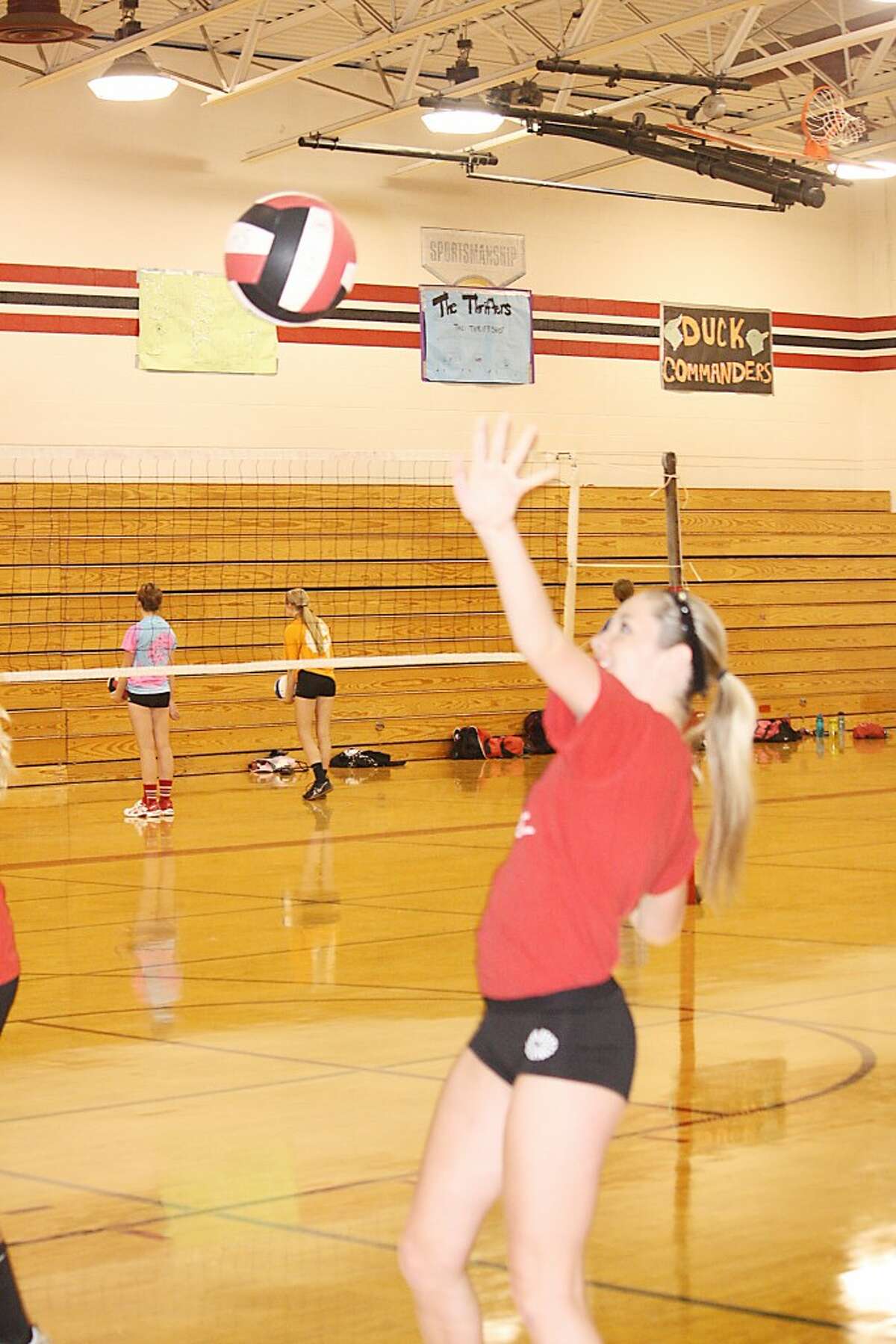 Drill: Liza Emington of Reed City goes through a hitting drill. (Herald Review/John Raffel)