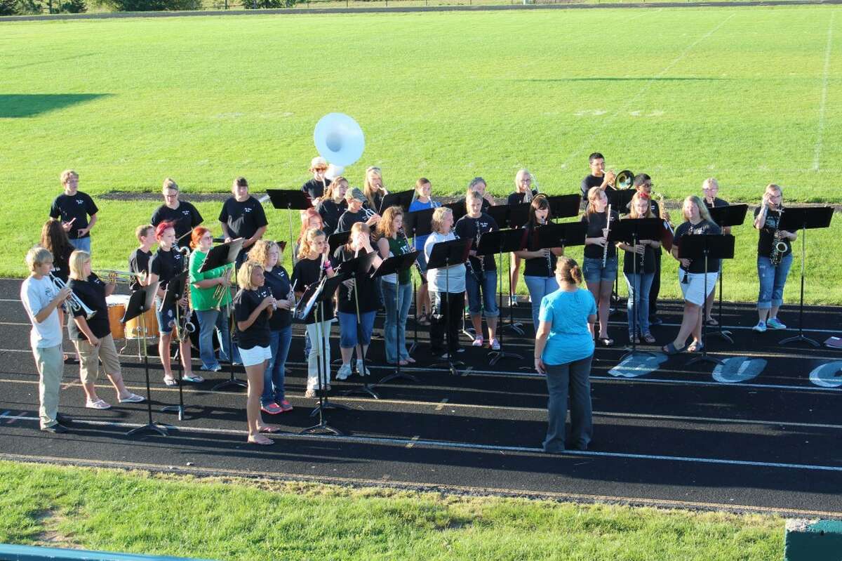 SCHOOL SPIRIT: The Pine River High School band, directed by Jessica Miller, serenades a crowd of K-12 students and their parents at Monday’s back-to-school celebration at the school.