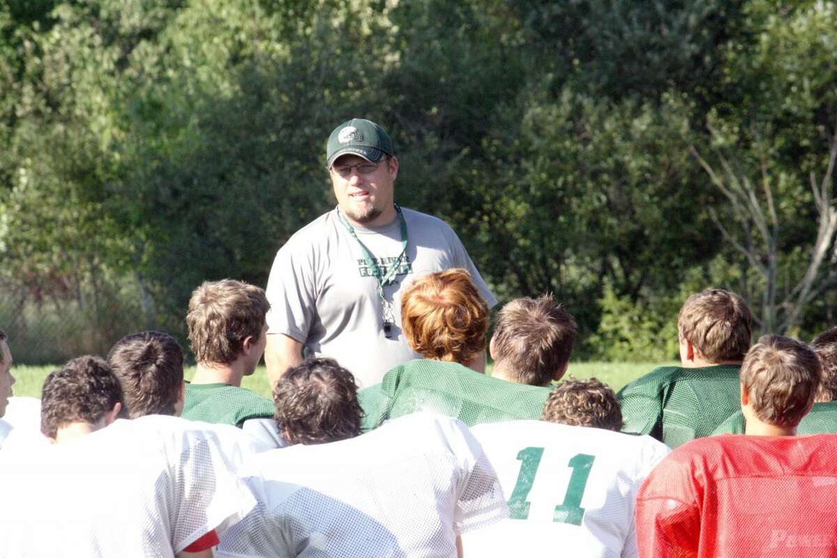 regroup: Pine River football coach Chad Phillips talks with his players at a recent practice. (Herald Review photo/John Raffel)