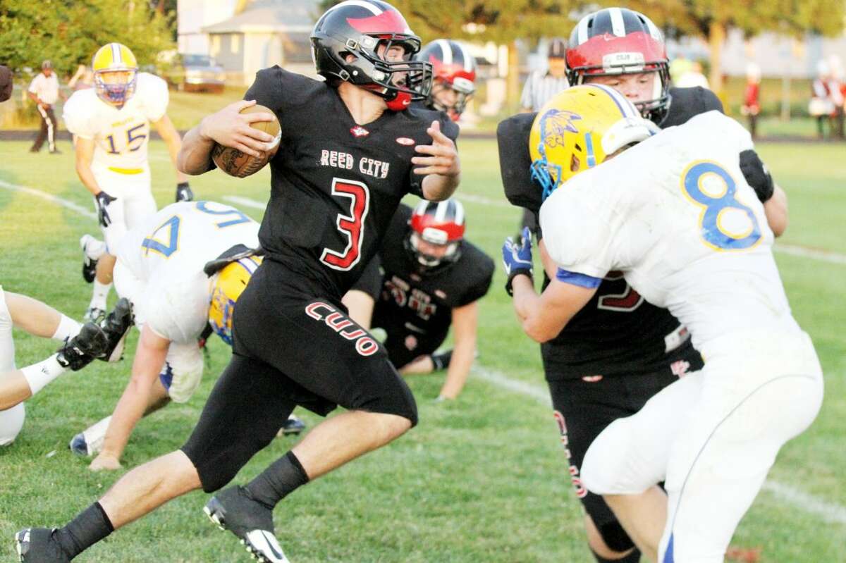 LOOKING AHEAD: Reed City's Chad Samuels looks to get some yardage during Thursday's game against Morley Stanwood. (Pioneer photo/Bob Allan)