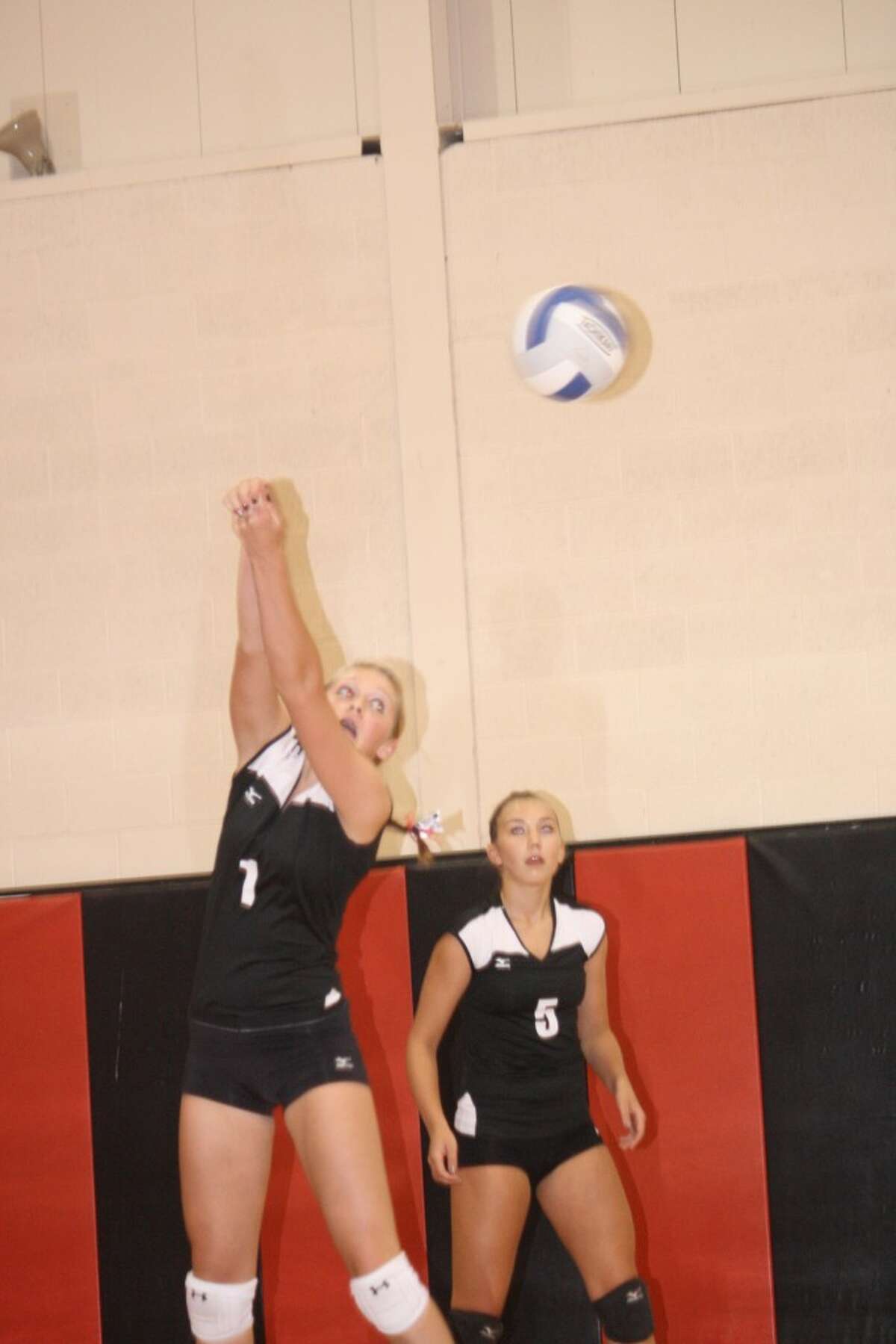SWEET RETURN: Michaela Reed sends the ball over the net against Big Rapids last week. (Herald Review photo/John Raffel)