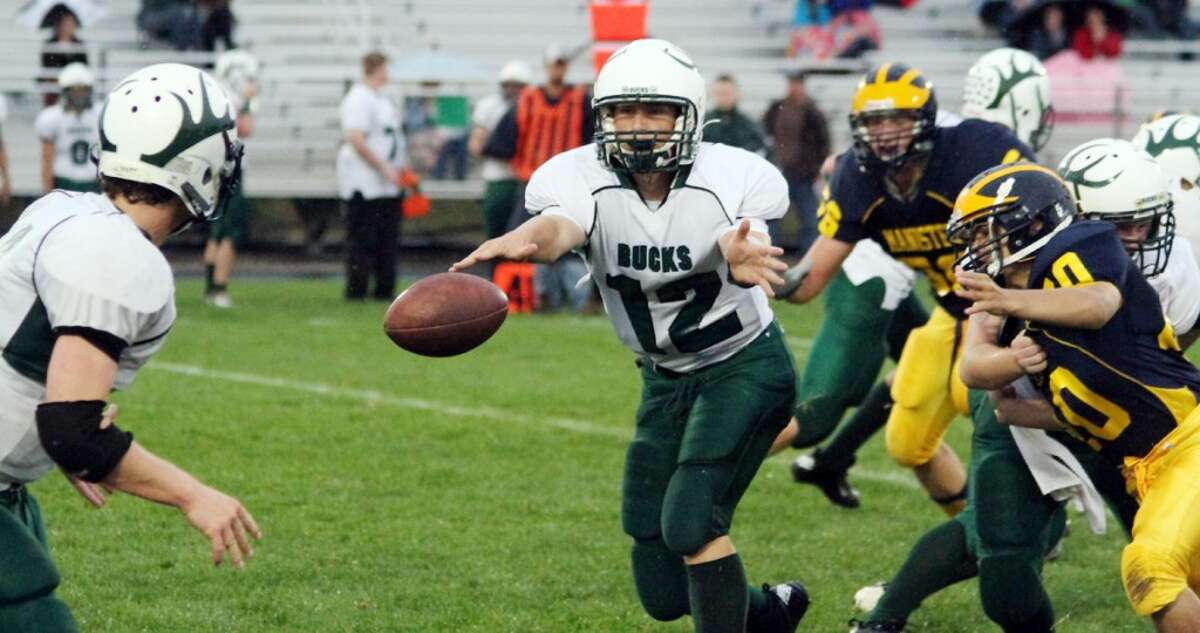 PITCH AND CATCH: Pine River’s Skyler Nelson pitches the ball from his quarterback spot against Manistee. (Pioneer photo/Matt Wenzel)