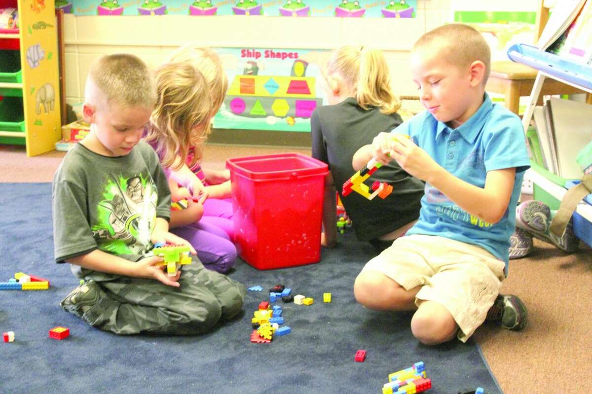 FREE TIME: Students in Sara Ladd’s first grade class construct various buildings and animals with Legos during free time in their first week of class. Many students said they were looking forward to recess, math and learning. (Herald Review photo/Sarah Neubecker)