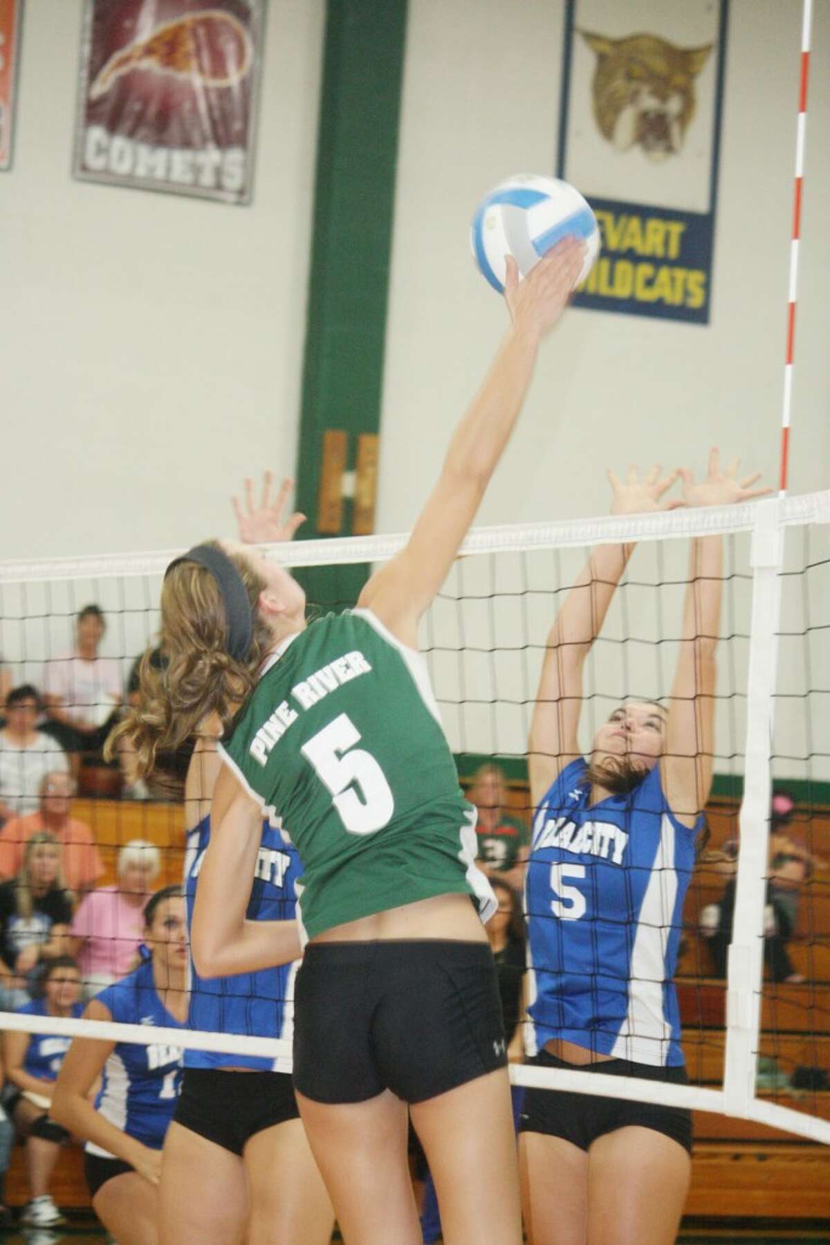 ELEVATION: Pine River's Jamie Justin (5) goes up for a kill on Tuesday against Beal City. (Herald Review photo/John Raffel)
