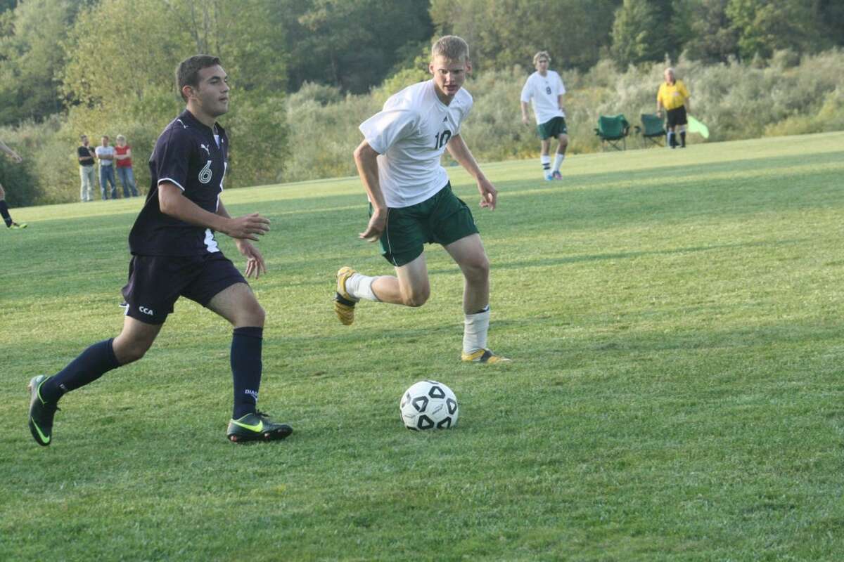 ON THE GO: Crossroads Rene Pivanti (left) looks to advance the ball up the field against Pine River. (Herald Review photo/John Raffel)