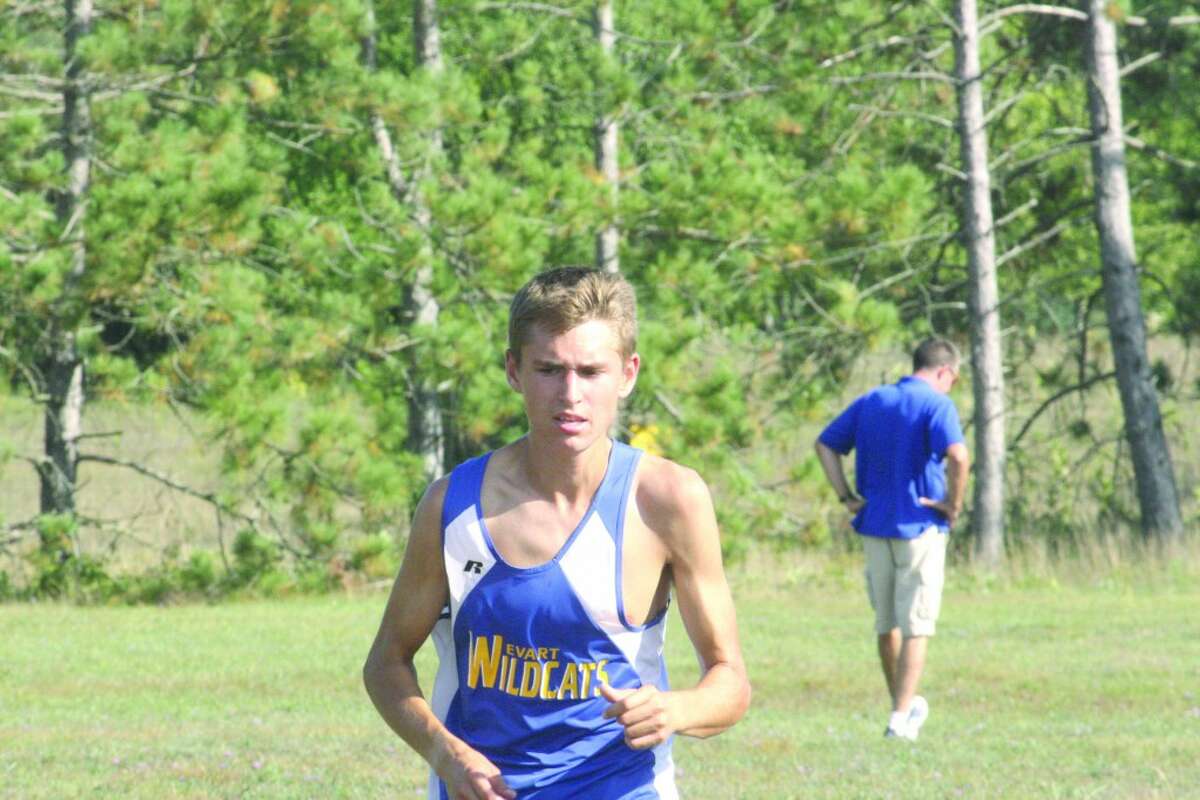 FINISHING STRONG: Max Hodges gets set to finish first in an Evart home cross country meet last week. (Herald Review photo/John Raffel)