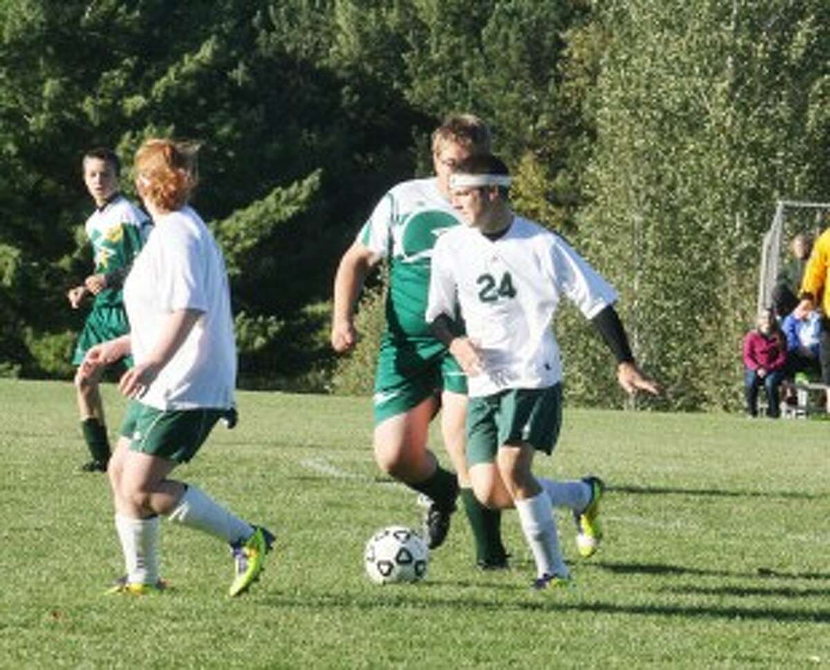 GET OPEN: Pine River's Larry Kissinger (24) looks to find an open teammate during Monday's high school soccer action. (Herald Review photo/John Raffel)