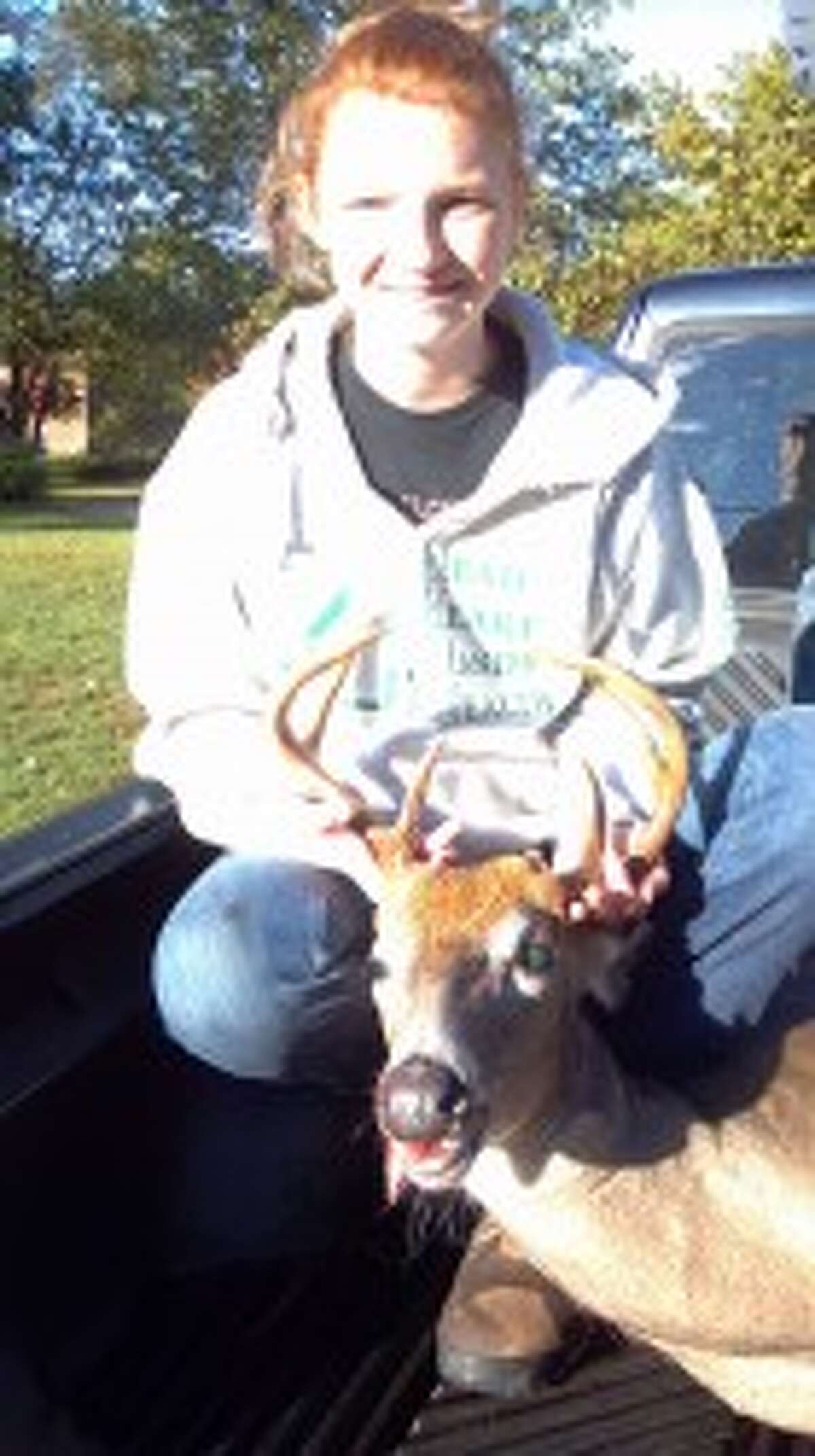 TROPHY BUCK: Meghan Borst of Reed City was a successful youth hunter over the weekend with an 8-point buck.