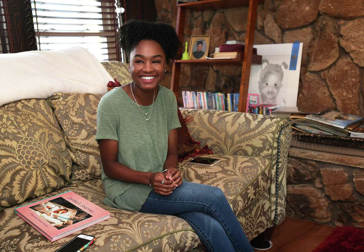 Jordan Scott talks Wednesday about the book she made to help families cope with premature births. Jordan, who was born three months premature, also submitted the book as part of her project to receive the Girl Scout's prestigious Gold Award. Photo taken Wednesday, 8/14/19
