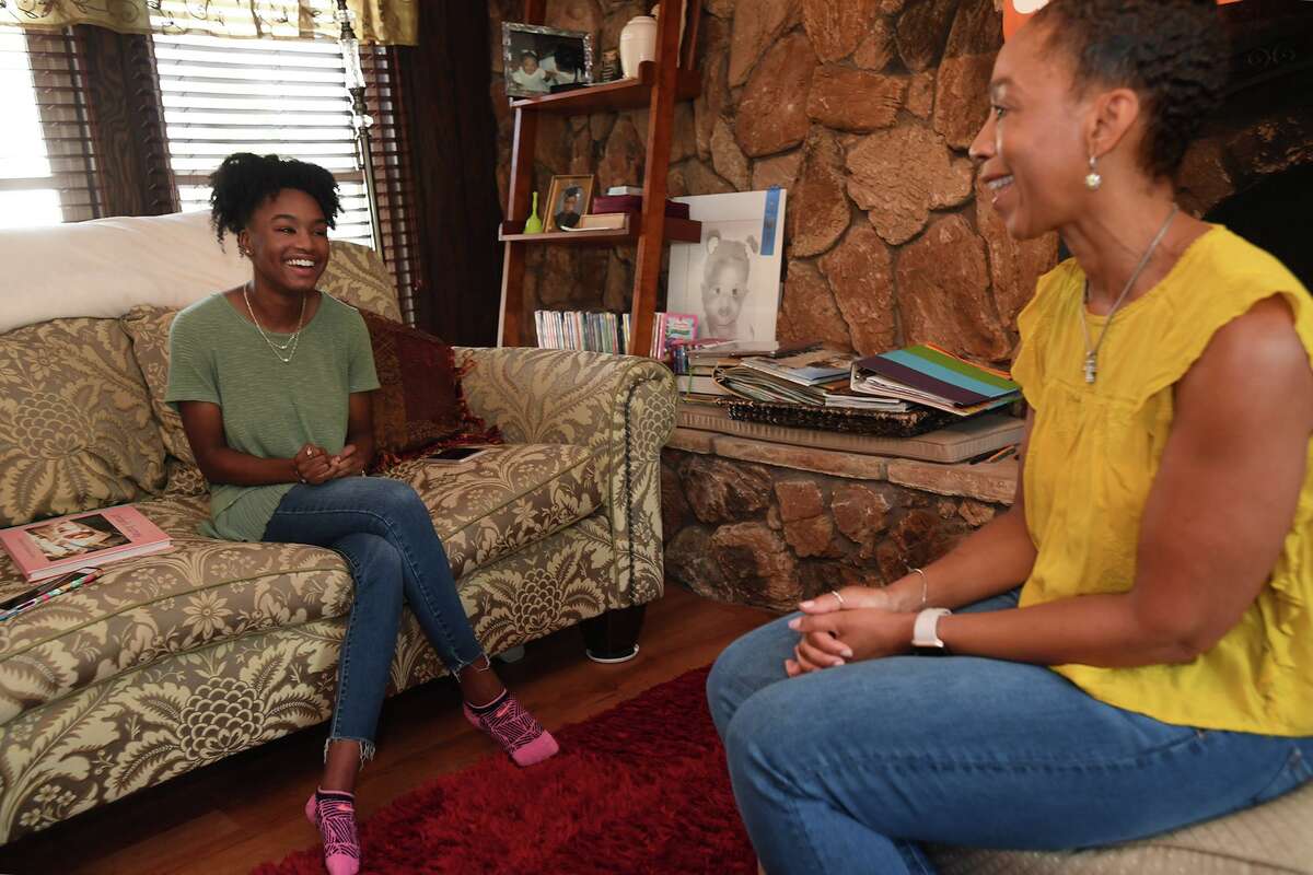 Jordan Scott talks to her mother Mary Scott at their Beaumont home on Wednesday. Jordan, who was born three months premature, made a book designed for families coping with premature births. Scott also submitted the book as part of her project to receive the Girl Scout's prestigious Gold Award. Photo taken Wednesday, 8/14/19