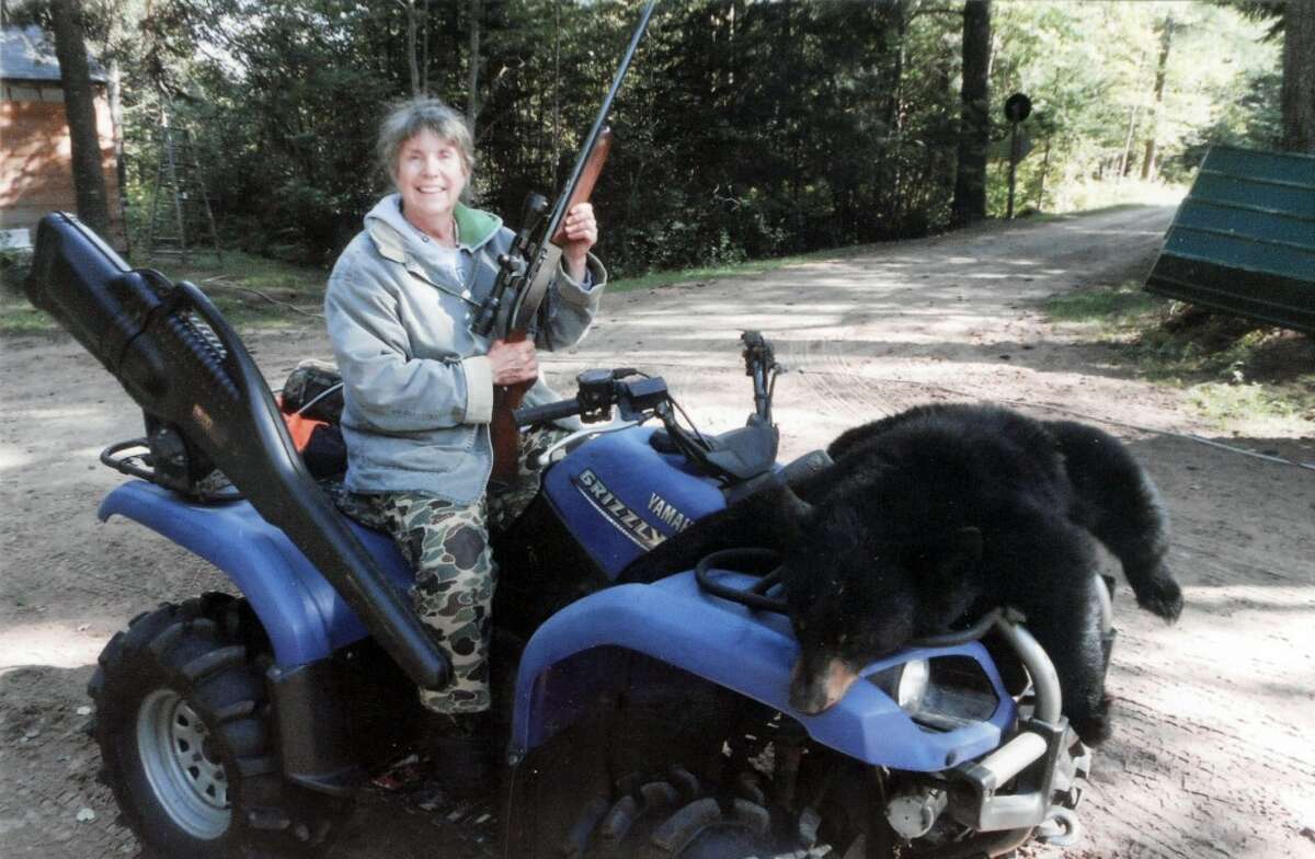 GRANNY'S GAME: Janet Hepinstall of Hersey shows the bear she bagged recently in the Upper Peninsula. (Courtesy photo)