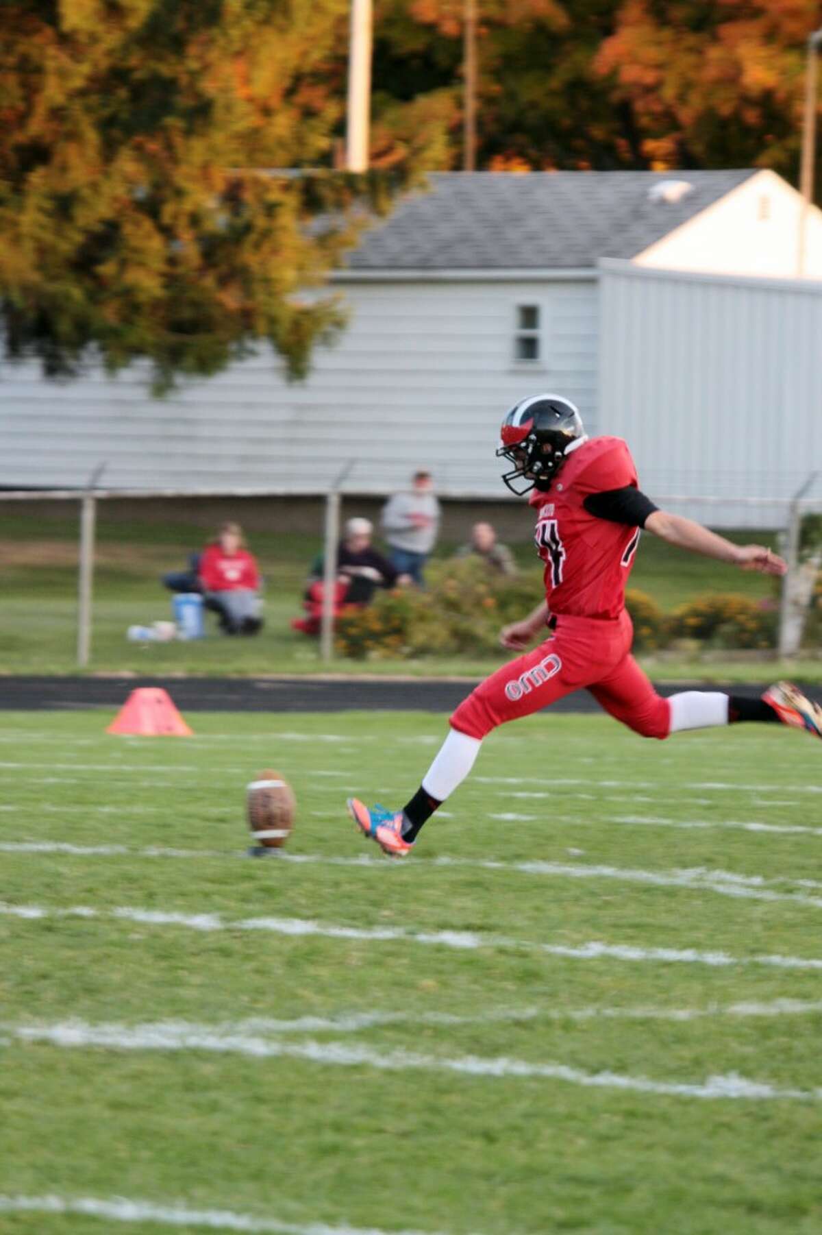 KICKING IT OLD SCHOOL: Ricky Droke does his kicking duties against Chippewa Hills. (Herald Review photo/Justin McKee)