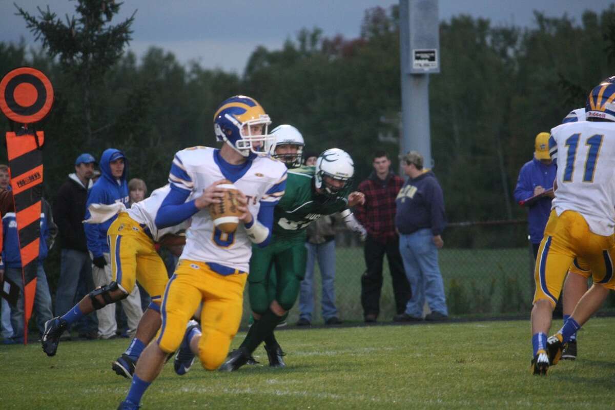 WORKING OUT OF THE POCKET: Quarterback Jacob Fortune looks downfield for an open receiver. (File photo)