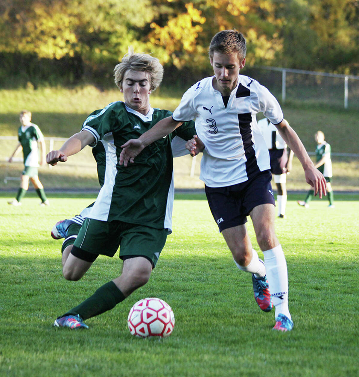 CONTROL: Crossroads' Blake McKenzie looks to advance the ball up the field against Pine River on Tuesday. (Herald Review photo/Bob Allan)