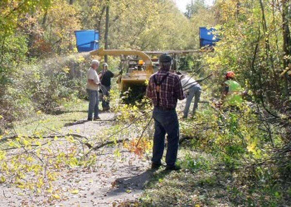 CLEARING THE WAY: Trail groomers work to clear areas of the Rails-to-Trails to prepare for winter recreational travelers.