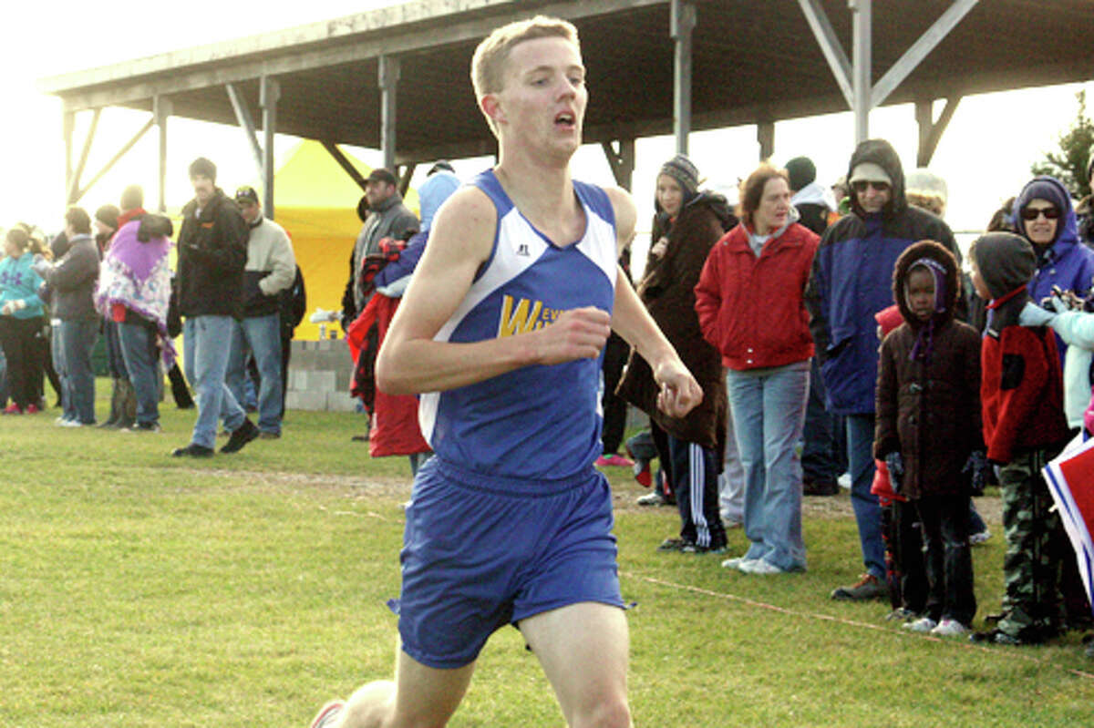 FINISHING STRONG: David Zinger heads to the finish line at the Pine River Invitational Saturday (Herald Review photo/John Raffel)