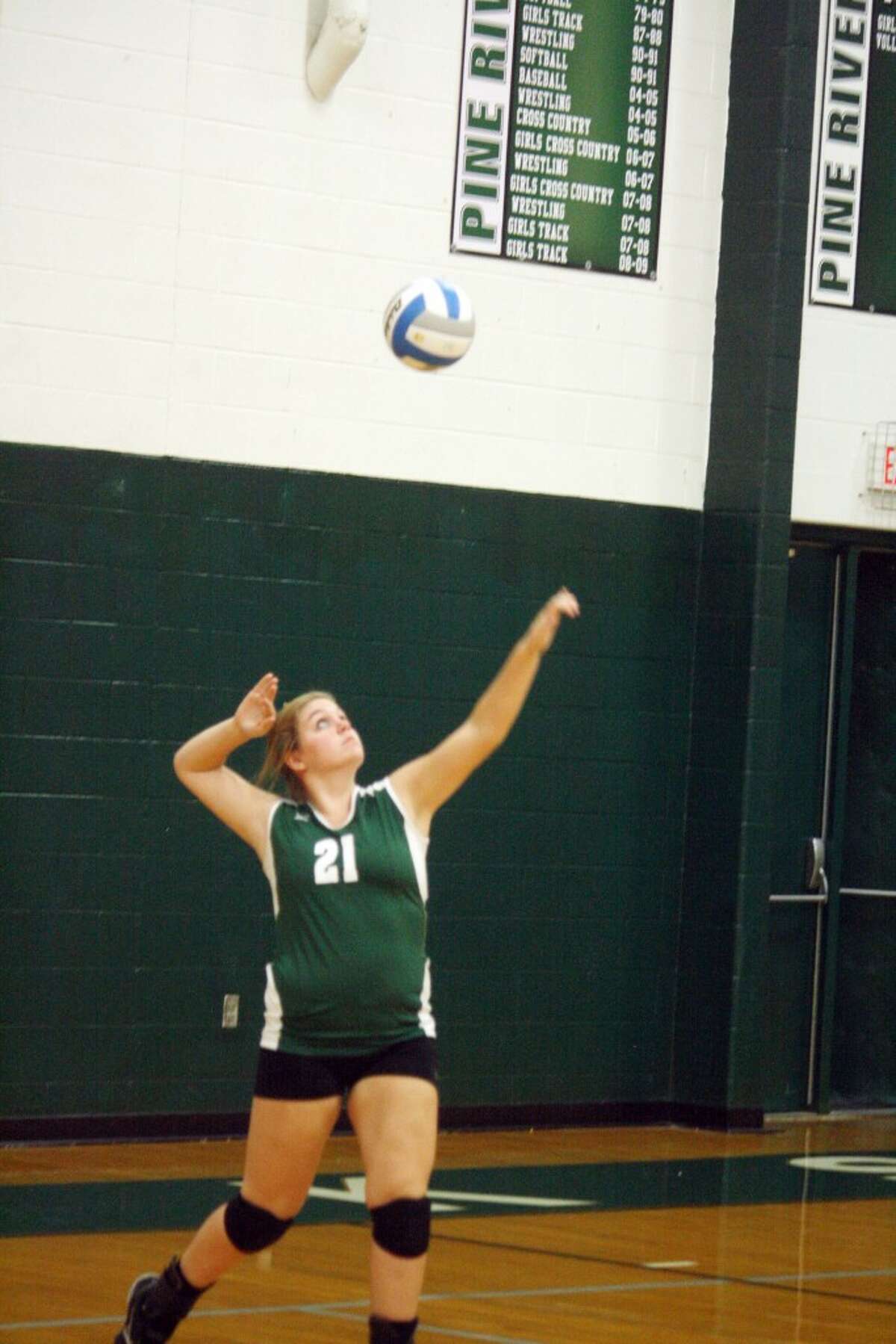 SERVING UP ACES: Alexis Stokely of Pine River gets set to serve the ball for the Bucks last week. (Herald Review photo/John Raffel)