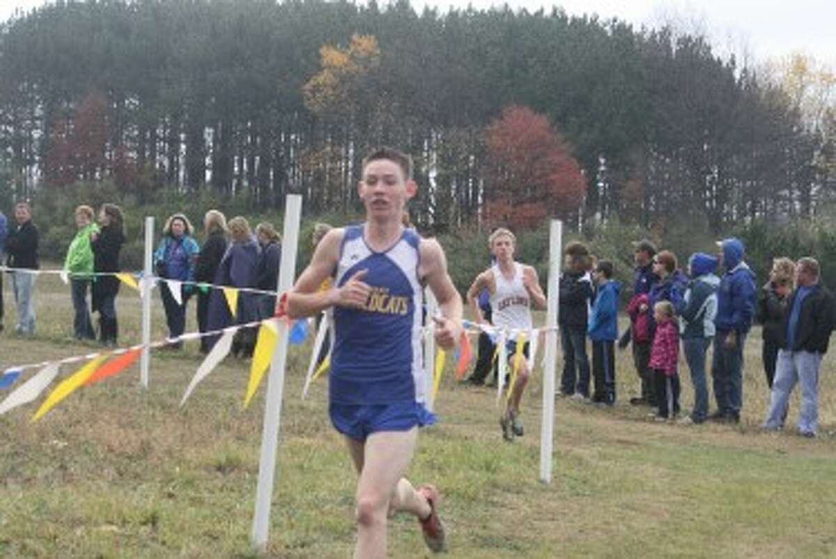 KEEPING PACE: Evart senior Logan Hammer works on his pace in the Chippewa Hills Invitational. (Herald Review photo/John Raffel)