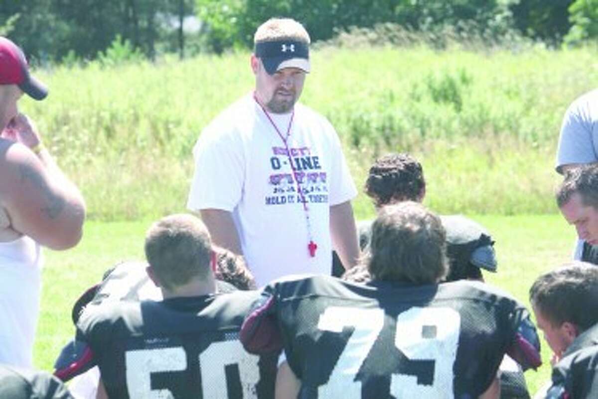 PREPARATION: Reed City football head coach Monty Price instructs his players during a practice earlier this year. (File photo)