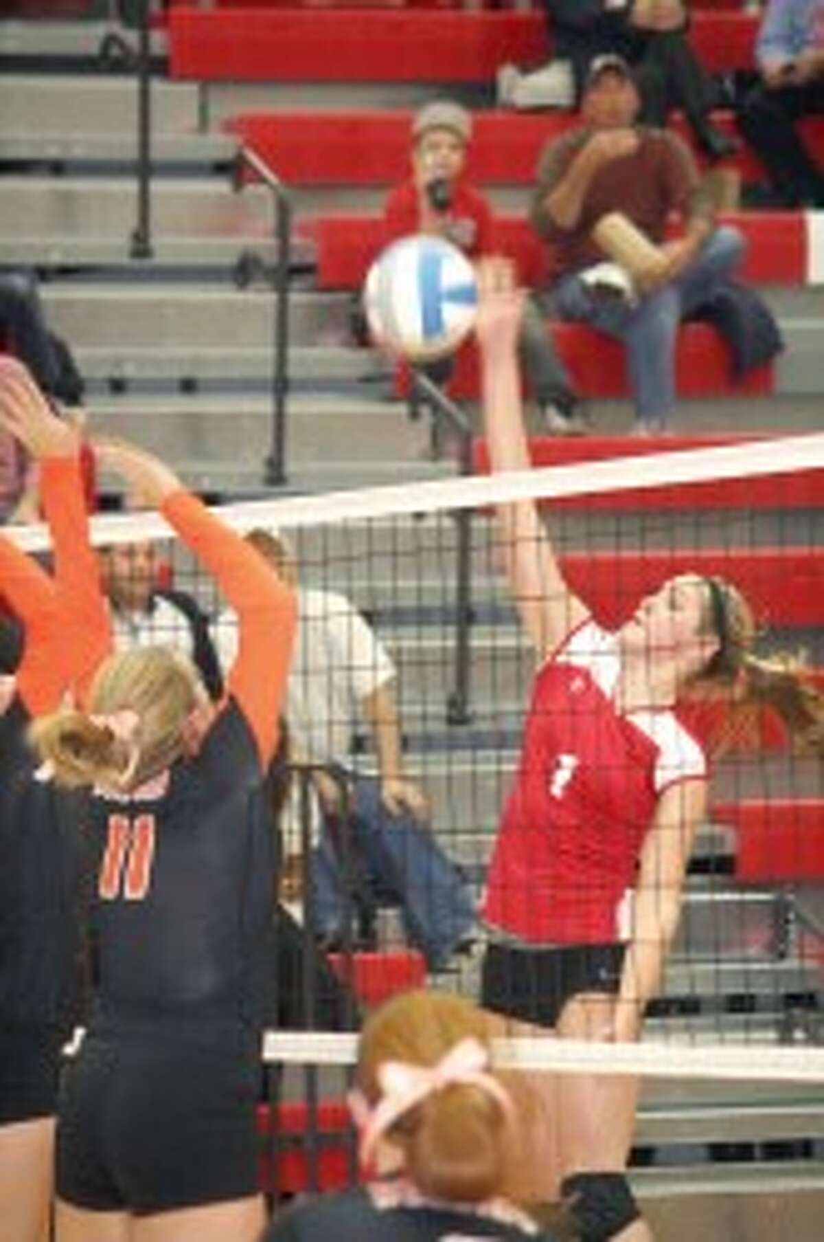 SPIKE: Reed CIty's Michaela Reed gets set to hit the ball over the net against Belding. (Herald Review photo/John Raffel)