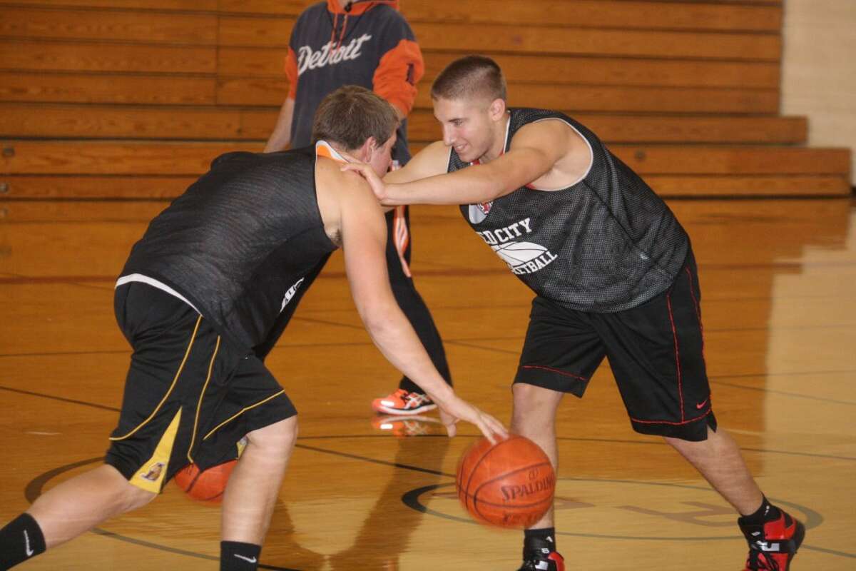 PREPARATION: Ryan Willis, left, and Trevor Nelson work on a drill during a Reed City boys basketball practice. (Herald Review photo/John Raffel)
