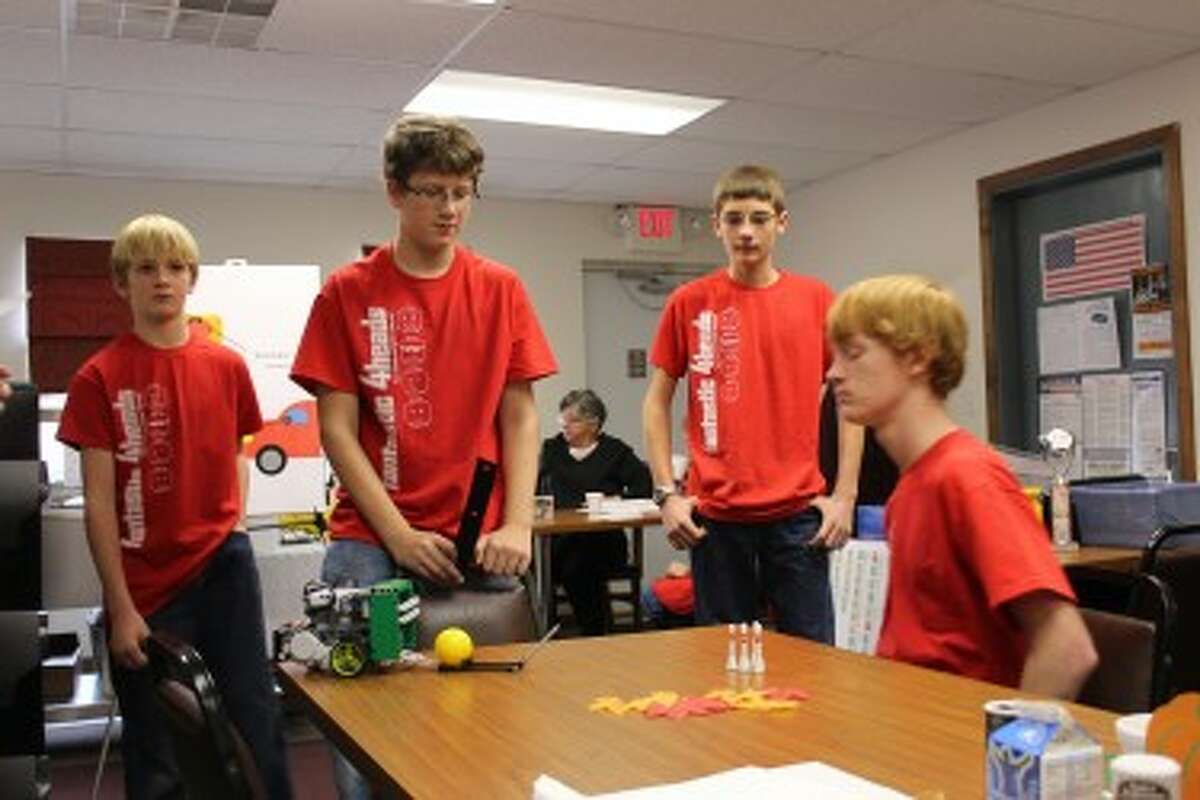 TECHNOLOGY: The Fantastic 4Heads show Evart senior citizens a robot they programmed to throw a ball to knock over bowling pins.