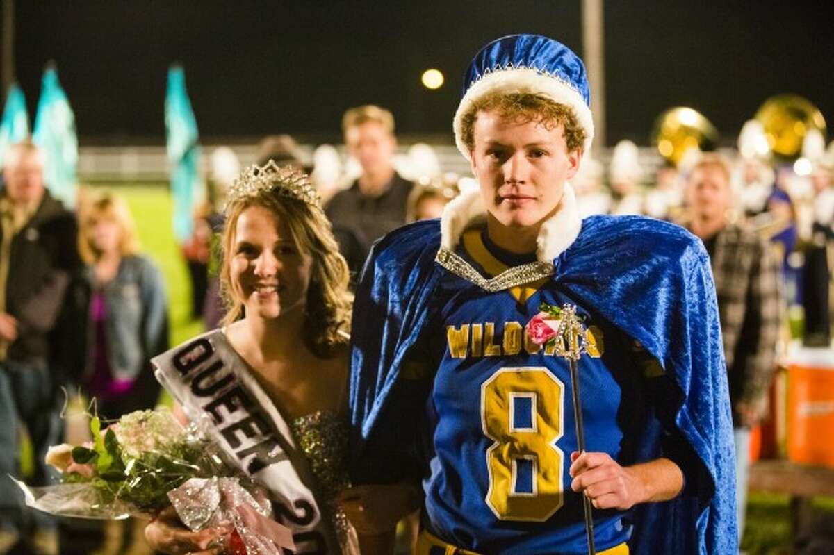 Evart High School seniors Nolan VanOrder (right) and Stevie Duey were named the 2014 homecoming king and queen during halftime at Friday's football game. Court members included Ben Randall and Erin Flowers for the freshman class, Jared Sherman and Katelyn Kozitzski for the sophomore class, Santana Scott and Brittani Leonhardt for the junior class, and Courtney Lang, Jacob Pattee, Natalie Belleville and Karl Clark for the senior class. (Herald Review photo/Justin McKee)
