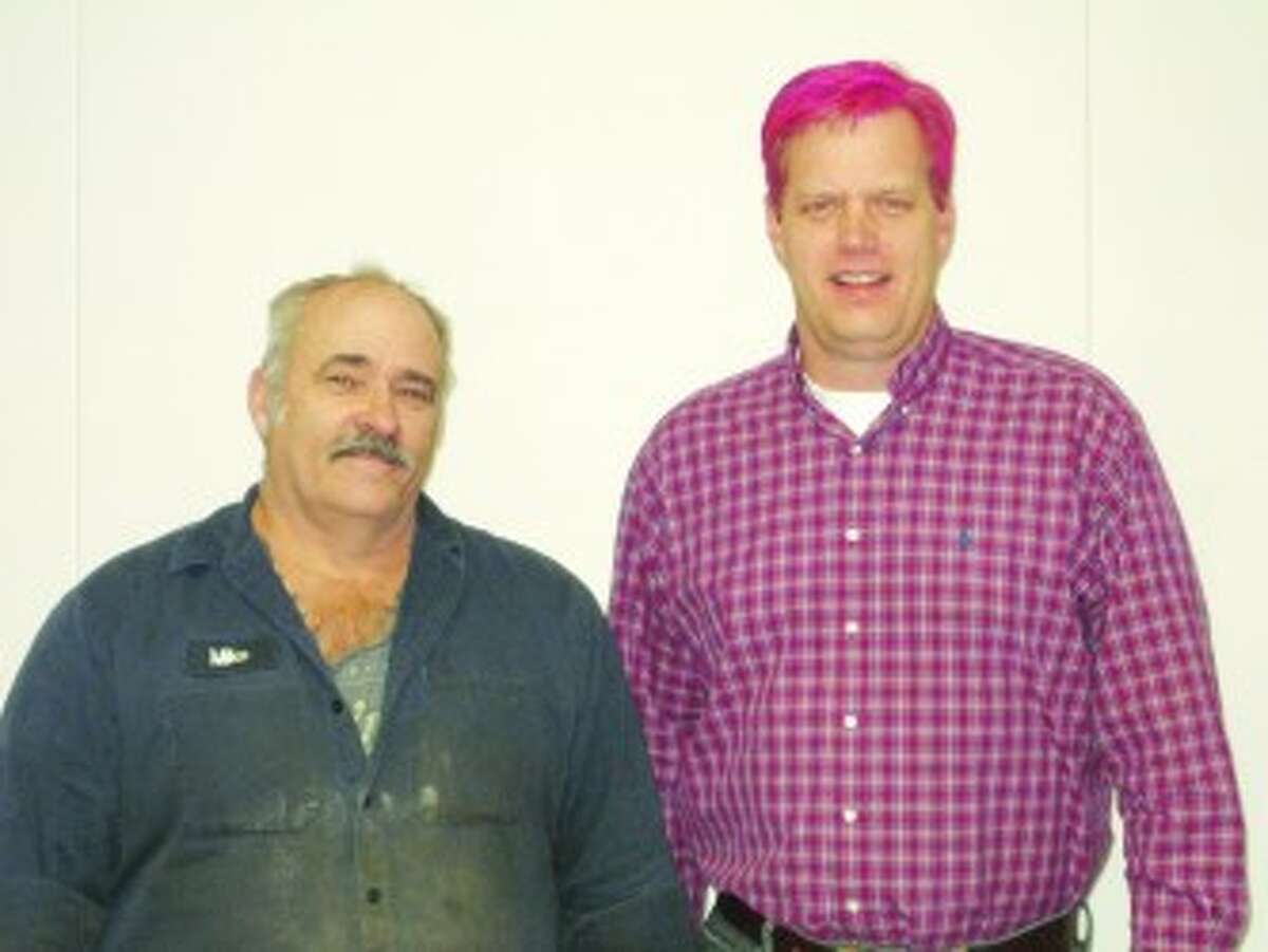 VACATION TIME: Mosaic Potash site manager Karl Tomaszesski (right) dyed his hair pink after the company met its United Way fundraising goal. Employee Mike Copeman (left) won 40 hours of vacation time at a reception held in celebration of the success. (Courtesy photos)