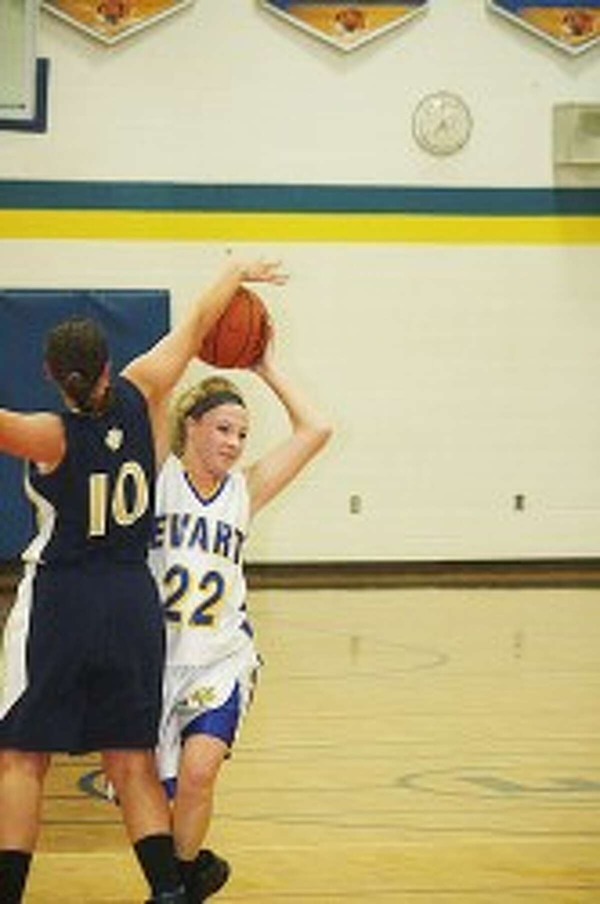 OUT OF REACH: Saige Nabozny of Evart tries to keep the ball away from Lakeview in action last week. (Pioneer photo/John Raffel)