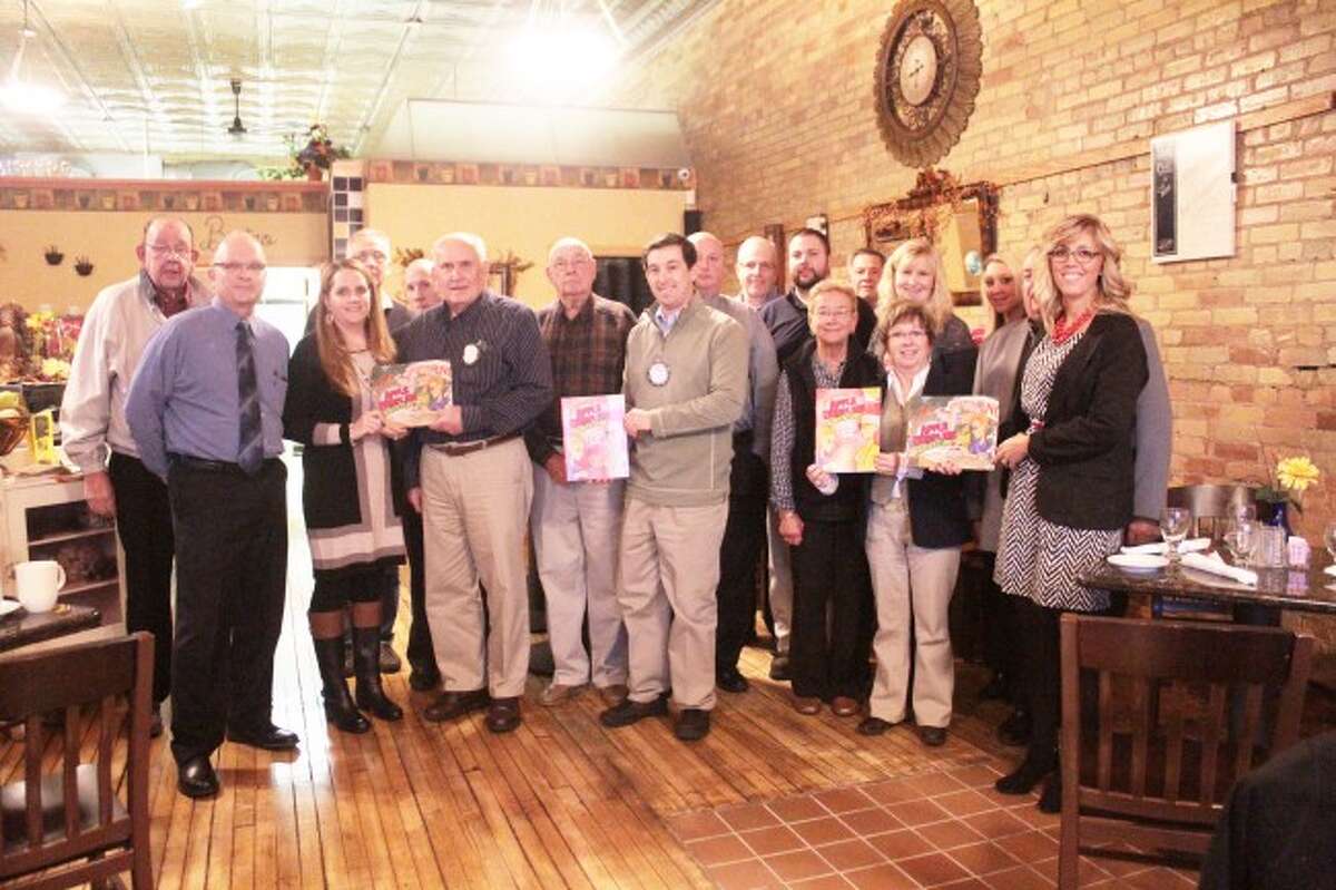 Rotary Club donates books to RCAPS and public library