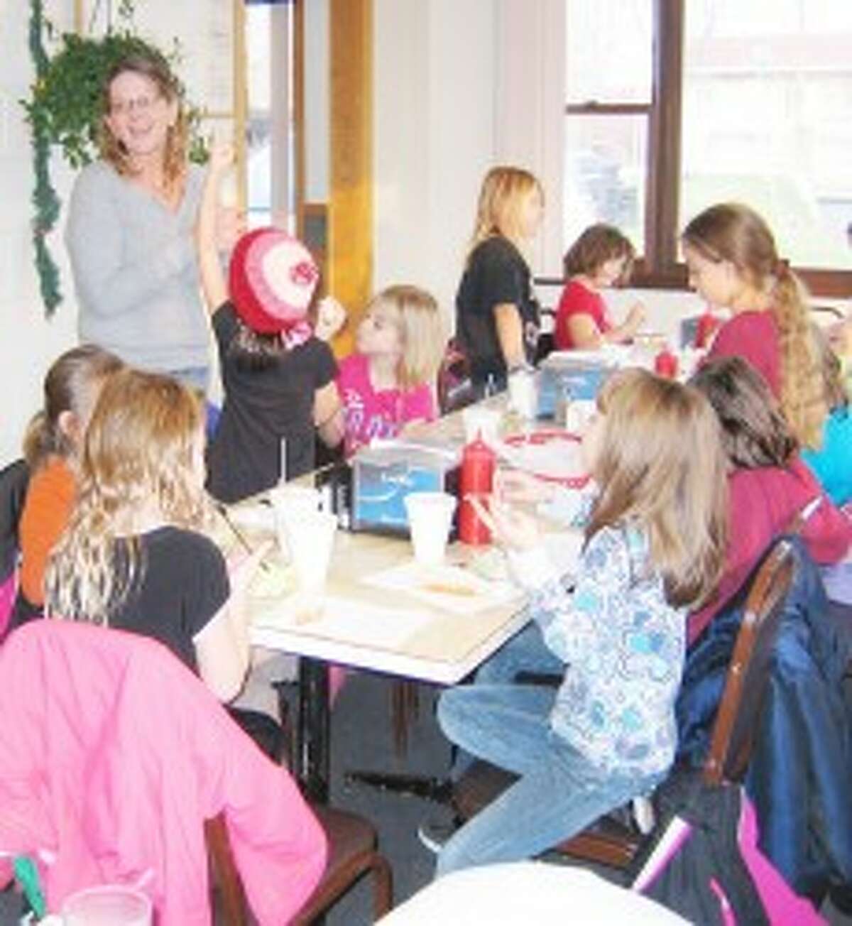 FOODFACTS: Ronnie Duncan (standing) talks to Brownies about healthy eating. (Courtesy photo)