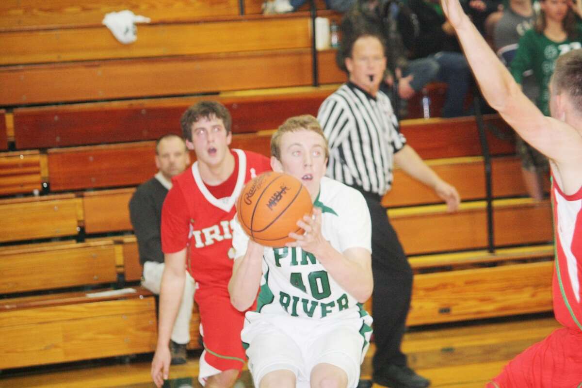 Lucas Harris (40) of Pine River looks to make a move against Sacred Heart. (Herald Review photo/John Raffel)