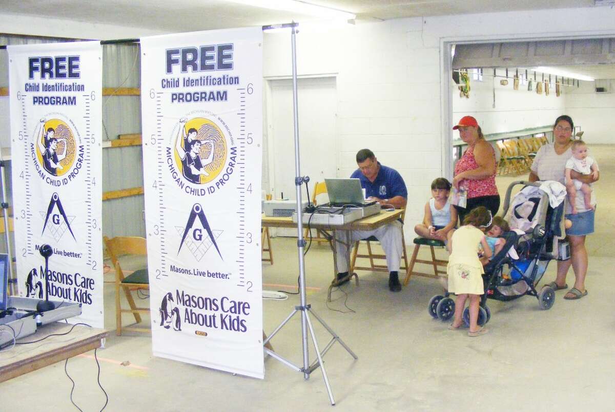 CHILD ID PROGRAM: The Evart Masonic Lodge participates in the Michigan Child ID Program, which provides identifying information such as a child’s height, weight, picture and voice recording to assist in searching if a child goes missing. The group facilitates the program at community events such as National Night Out in August and the Marion and Osceola County fairs. (Herald Review file photos)