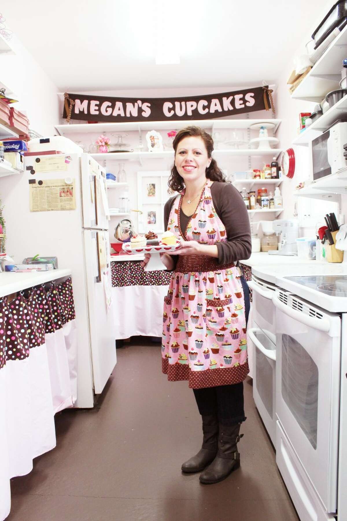 ONE-WOMAN OPERATION: Bridget Coffey, of Cadillac, started Megan’s Cupcakes in 2008. She caters events and parties across Northern Michigan, offering delivery service and a variety of tastes. (Herald Review photos/Sarah Neubecker)
