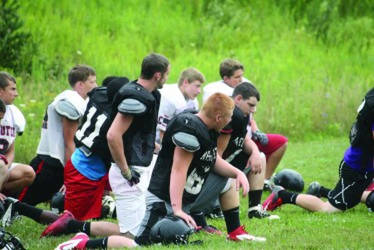 PREPARATIONS: Reed City football players get ready for a recent practice. (Herald Review photo/John Raffel)