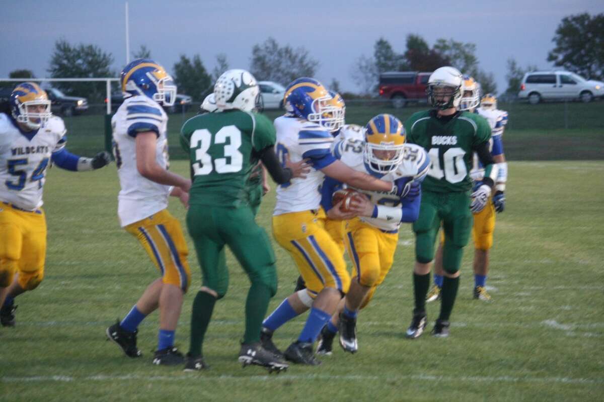 TURNOVER: Larry VanBuren (52) grabs the loose football after a punt attempt by Pine River. (Herald Review photo/John Raffel)