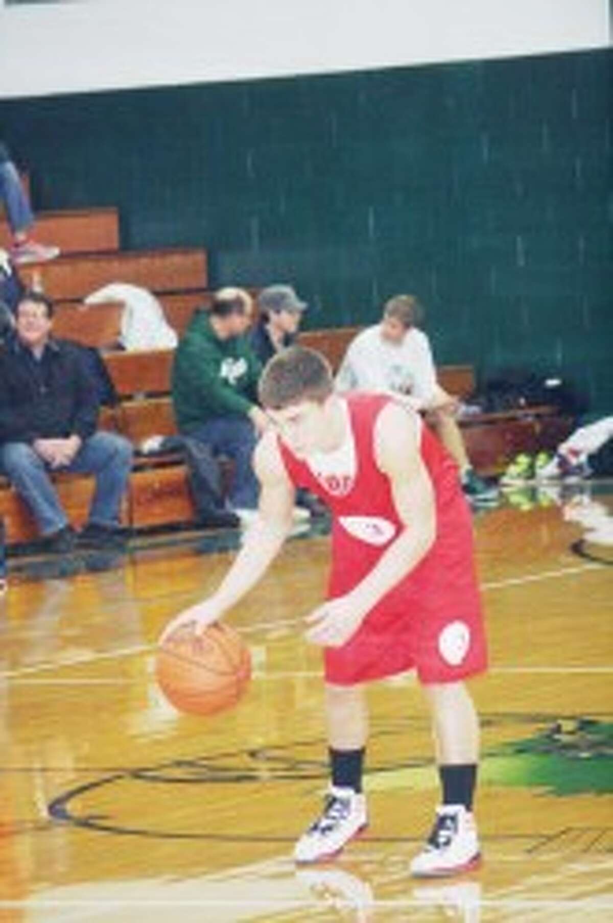 Fitness: Josh Saez dribble the ball while looking to make a move for Reed City against Tri County in a Friday scrimmage. (Herald Review photo/John Raffel)