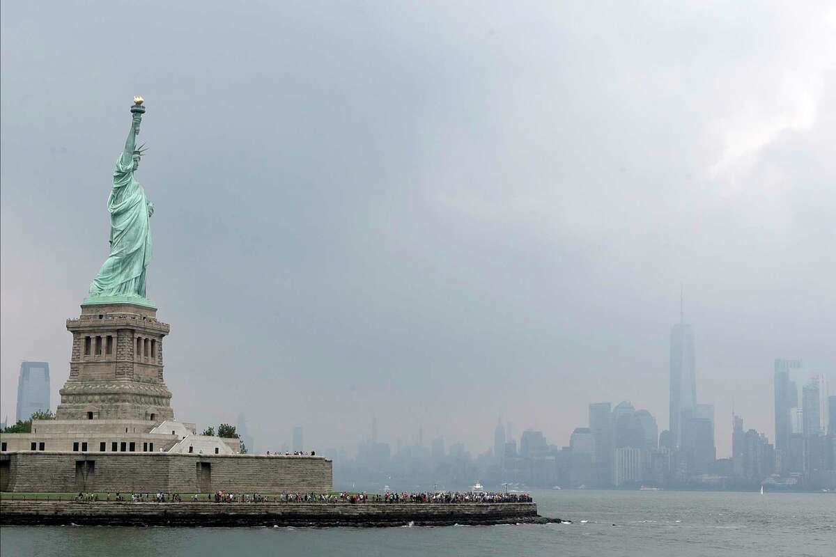 The Statue of Liberty on a stormy afternoon in New York. (AP Photo/Kathy Willens)