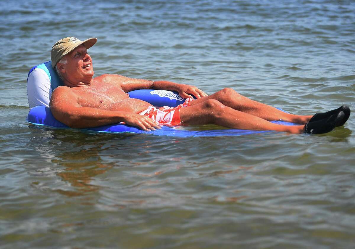 Bob St.John, of North Haven, beats the heat with a cooling float on the Sound in Milford, Conn. on Monday, August 19, 2019.