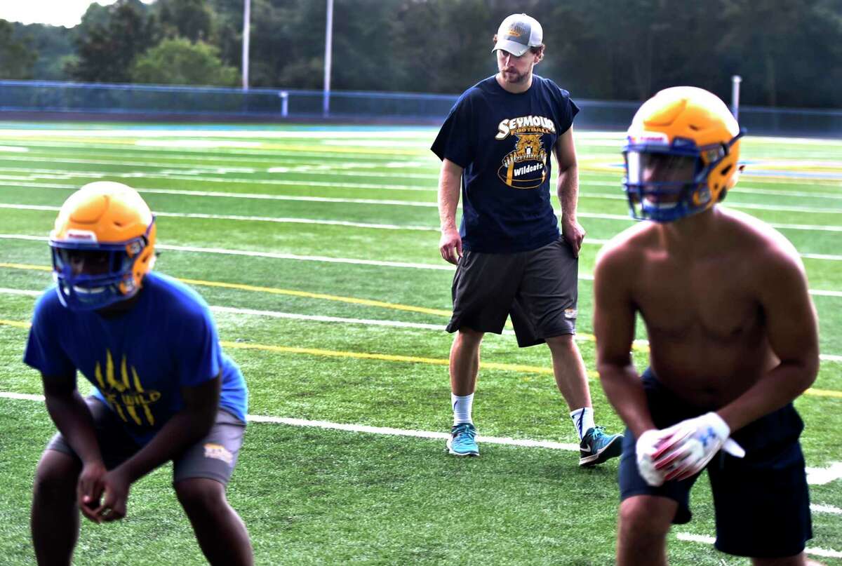 First-year Seymour football coach Michael Kearns looks on during the first day of practice on Monday.