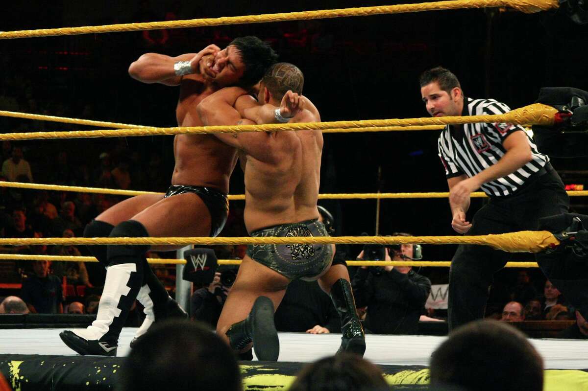 David "A-List" Otunga, right, works to take down Justin Gabriel in the WWE Smackdown's NXT rookie bout, at Mohegan Sun in Uncasville, Conn., on April 20, 2010. NXT, WWE's main showcase for up-and-coming talent, is set to start airing Sept. 18, 2019 on cable TV’s USA Network.