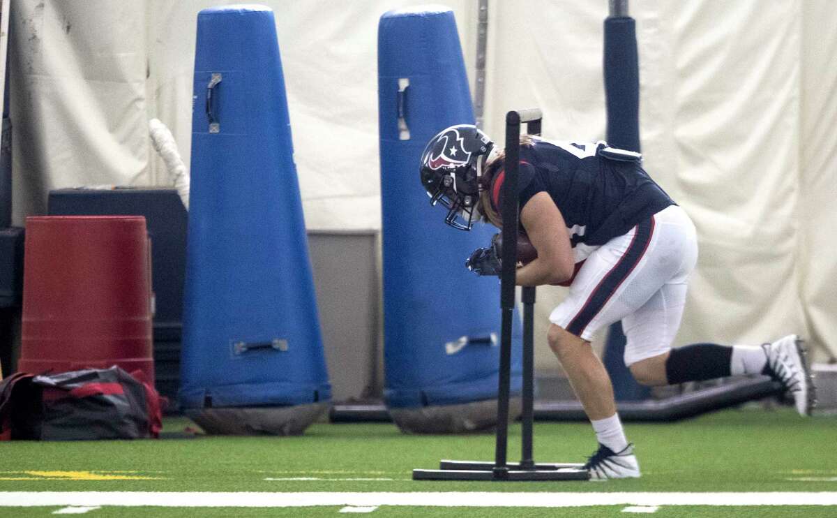 Houston Texans running back Cullen Gillaspia ducks under a bar while running a drill during training camp at the Methodist Training Center on Tuesday, Aug. 20, 2019, in Houston.
