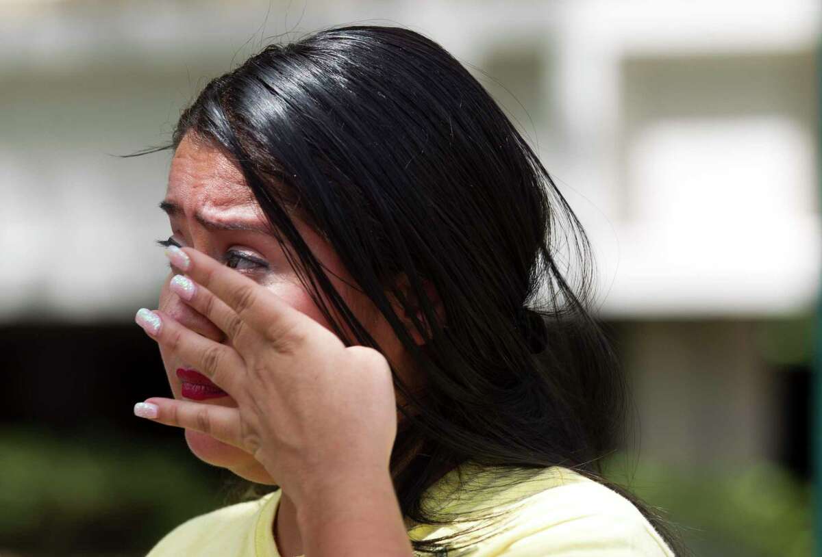 Yancy Balderas wipes aware tears as she shares her views on capital punishment as she and others gather outside the Montgomery County Courthouse in support of Larry Swearingen, Tuesday, Aug. 20, 2019, in Conroe. Balderas’ husband, Juan, is on death row for a gang related shooting in 2005. Swearingen was sentenced to die nearly two decades ago, after a jury convicted him of raping and murdering 19-year-old Montgomery County college student Melissa Trotter, then dumping her body in Sam Houston National Forest. Swearingen has dodged five execution dates since his original execution data in 2007, and is schedule to die by lethal injection in Huntsville on Aug. 21. Previously, his date was reset in October 2017 because the Montgomery County District Clerk's office sent the execution order to the wrong place.