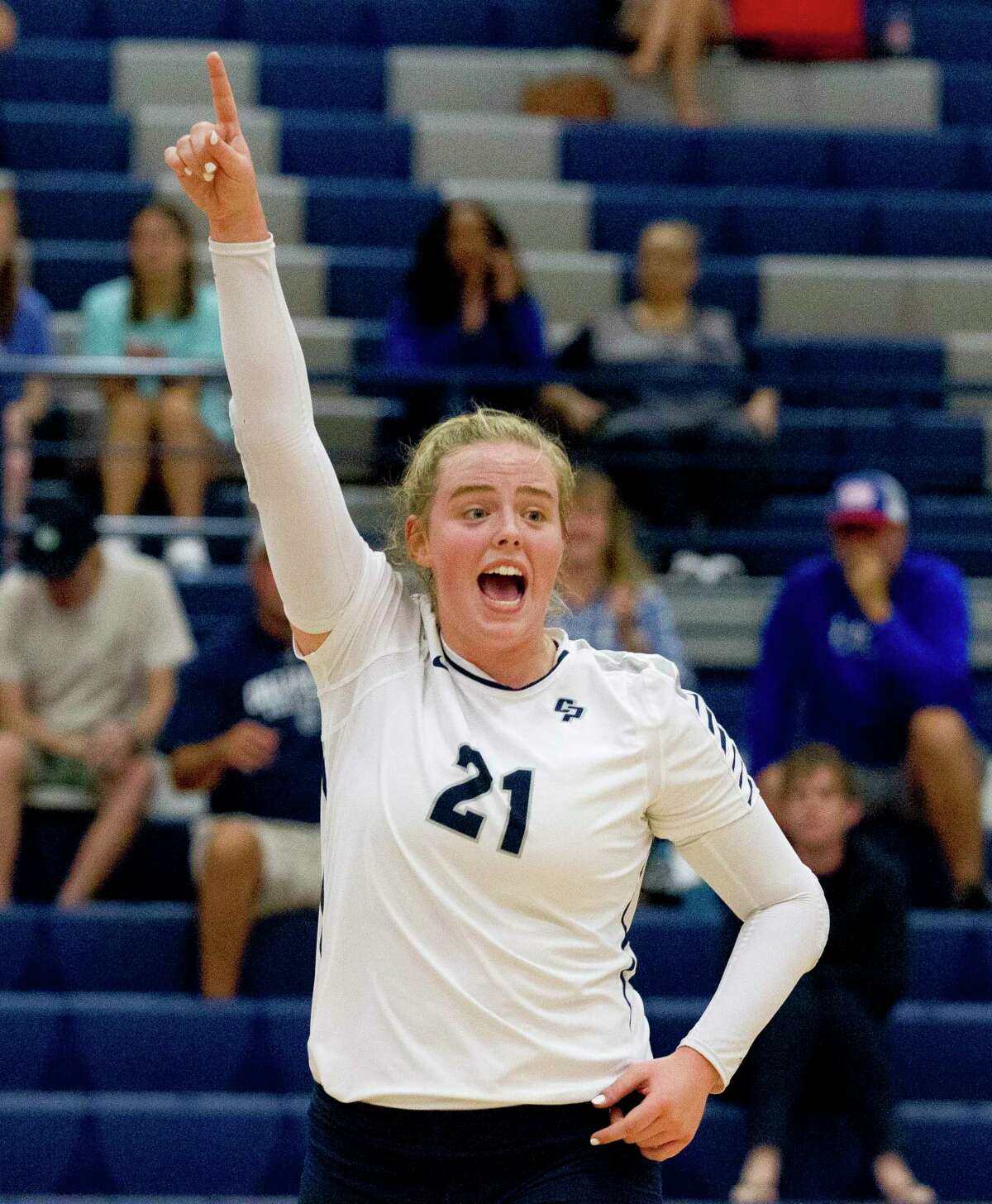 College Park setter Annie Cooke (21) reacts after a point in the first set of a match during the Kingwood Invitational volleyball tournament at Kingwood High School, Saturday, Aug. 17, 2019, in Kingwood.
