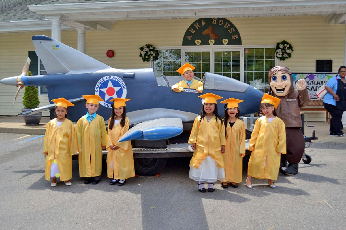 Children pose on graduation day at Anna House, the day care and preschool at Belmont Park Race Track. A sister center will open at Saratoga Race Course, hopefully next summer.