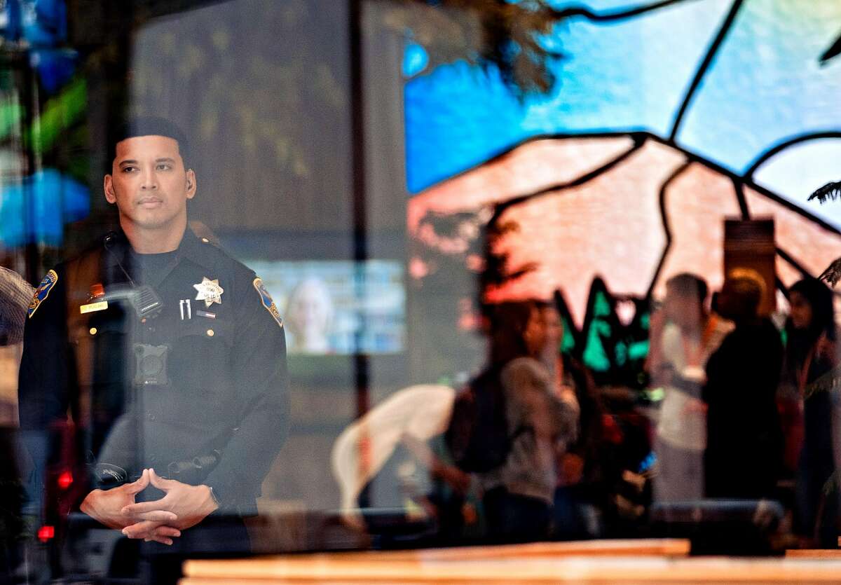 August 20, 2019 - A police officer is seen in the lobby of the Salesforce Tower. From the Salesforce Tower on Mission Street to Ross Dress for Less on on Market Street, San Francisco businesses are shelling out more than $100 an hour in record numbers for overtime police officers to work as private security guards as a hedge against the ongoing plauge of thefts and assaults in the downtown.