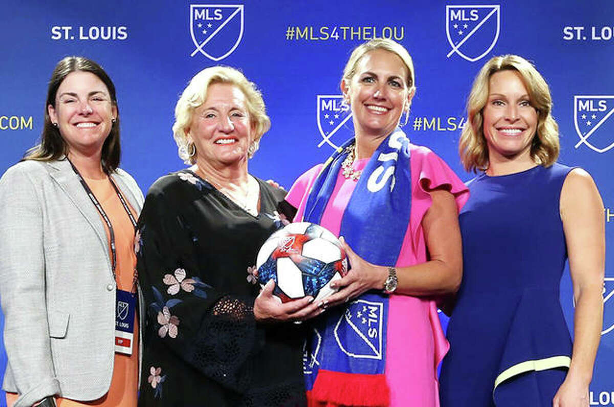 Four members of the new St. Louis Major League Soccer franchise ownership group, pose for photos following the announcement Tuesday in St. Louis. From left are) are Patty Taylor, Jo Ann Taylor Kindle, Carolyn Kindle Betz, and Chrissy Taylor. This group is the only all female owned franchise in MLS.
