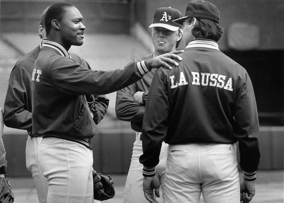 A's Friday night starting pitcher Dave Stewart seemed to be having a serious discussion with manager Tony La Russa but was only questioning whether he should wait after practice for a meeting. Pitching coach Dave Duncan looks on October 24, 1989.